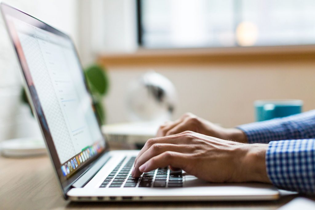 Cover letter writing taking place on a laptop